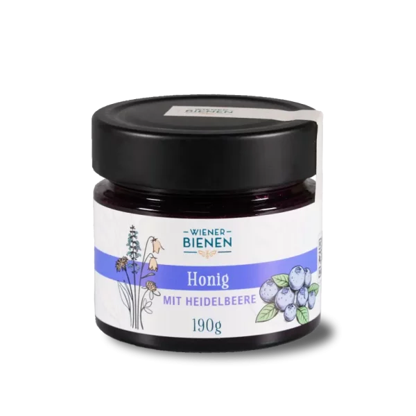 190g-Glas Wiener Bienen Cremehonig mit Heidelbeeren, tiefviolette Farbe und Etikett mit Heidelbeer-Illustration.