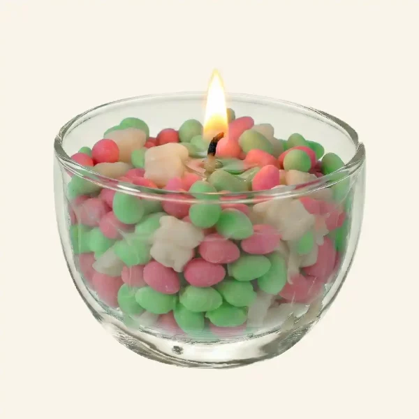 Spielkerze für Ostern rosa und grüne Wachseier und weiße Wachshäschen